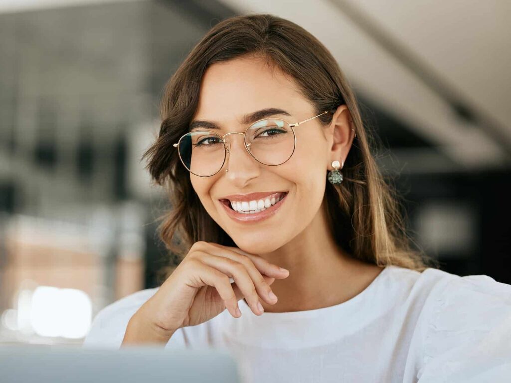 Woman showing off her beautiful smile min