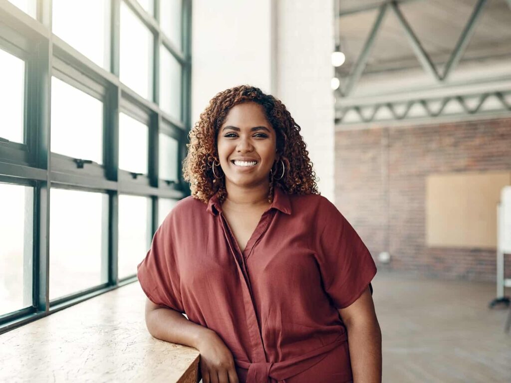 Woman smiling in office min